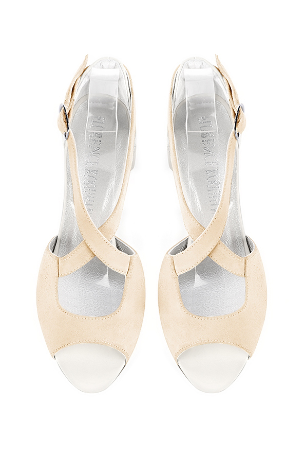 Women's egg shell beige and off white elegant sandals closed at the back with crossed straps. Round toe. Low flare heels - Top view